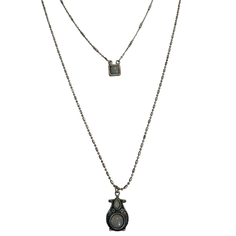 Double layered grey blue stones in silvered colored metal setting. The Buckle